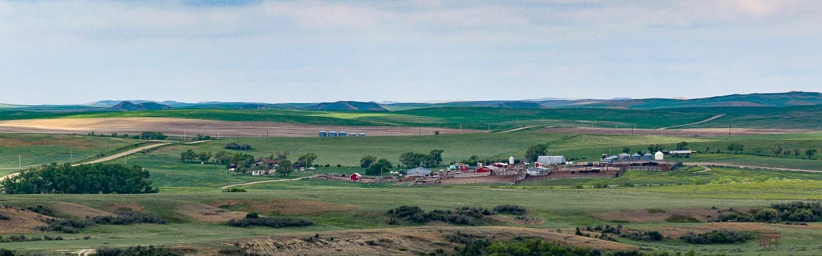 Stunning view of the ranch buildings and the open country around it.